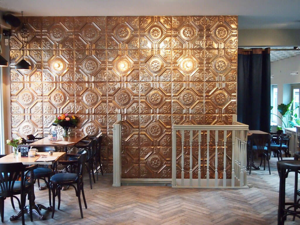 Copper wall tiles in cafe interior