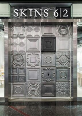 Metal wall tiles in shop design