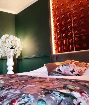 Copper wall tiles in bedroom